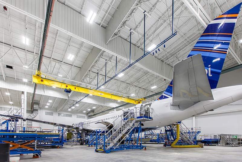 Airplane sitting inside Lufthansa Technik Heavy Maintenance Facility.